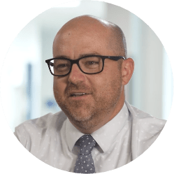 Michael Meechin, Principal at NeoCity Academy, smiling during an interview.