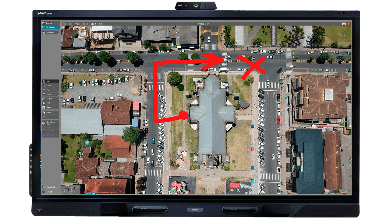 SMART Board QX Pro V2 displaying an aerial map with hand-drawn red annotations using SMART Meeting Pro.